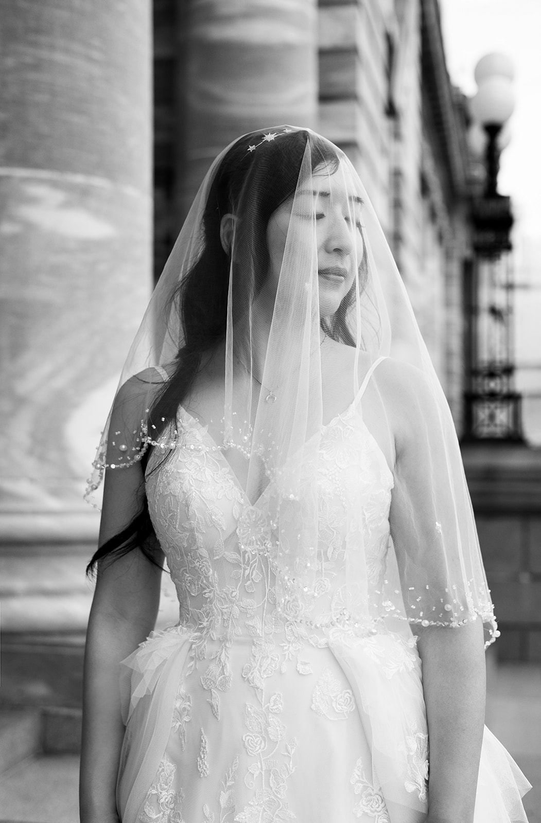 Black and white bridal portrait of Cornelia beneath her veil in Wellington.