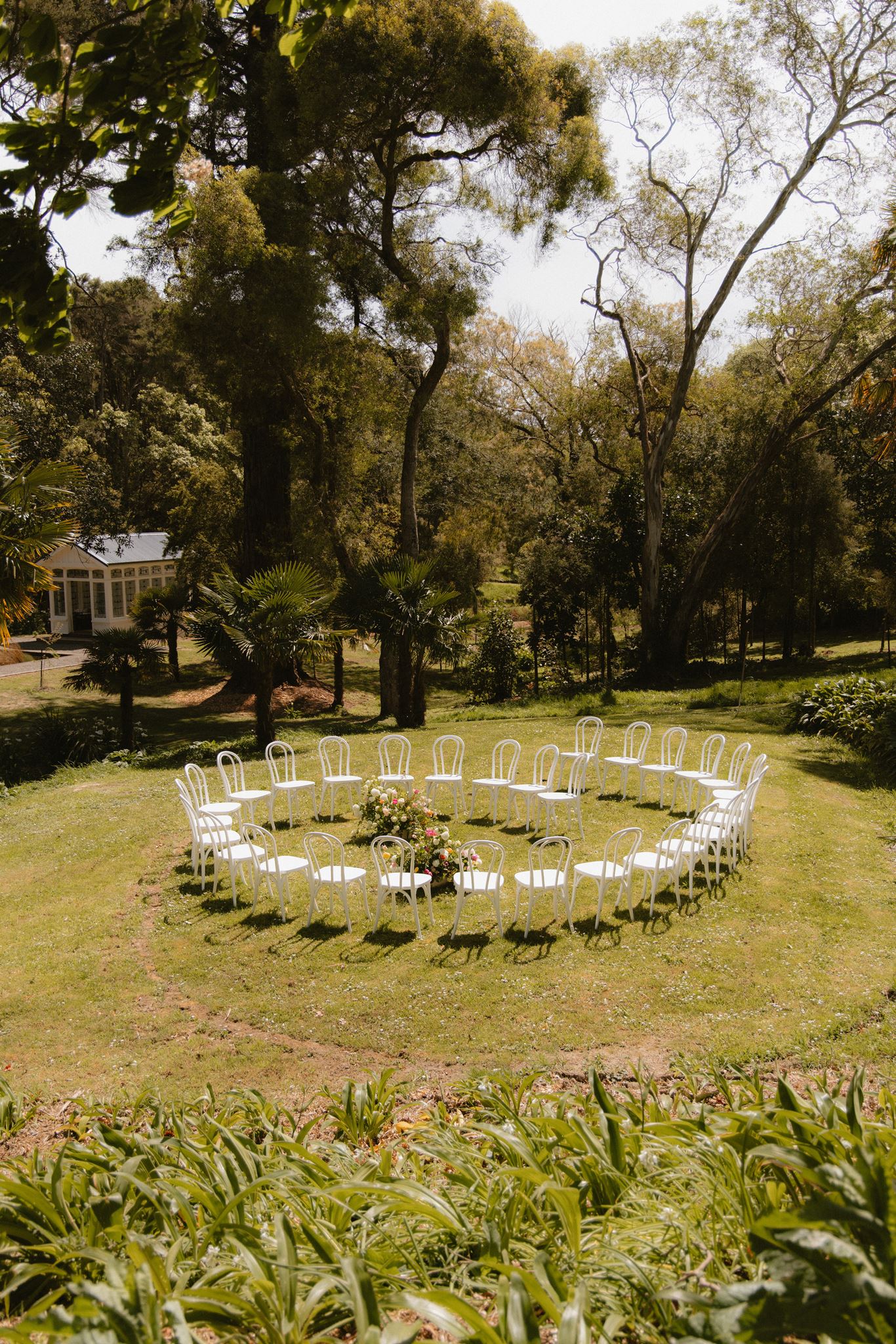 Outdoor wedding ceremony setup beneath the trees at Glendower Station.