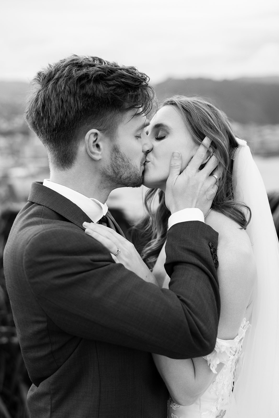 Black and white close-up of Jade and Tyler kissing during their Wellington wedding portrait session.