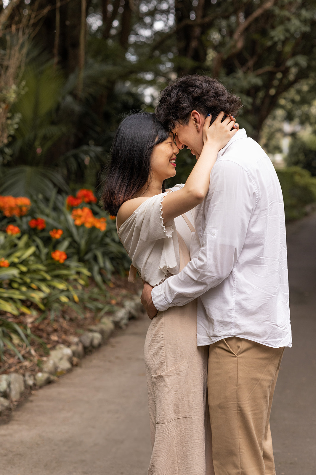 Shirley and Rob laughing together during their couples photography session at The Esplanade in Palmerston North.